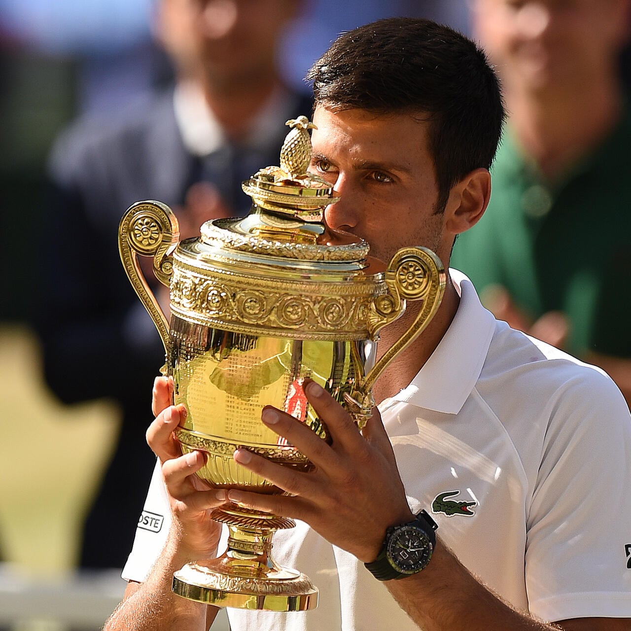 Serbia's Novak Djokovic kisses the winners the trophy after beating South Africa's Kevin Anderson 6-2, 6-2, 7-6 in their men's singles final match on the thirteenth day of the 2018 Wimbledon Championships at The All England Lawn Tennis Club in Wimbledon, southwest London, on July 15, 2018. / AFP PHOTO / Oli SCARFF / RESTRICTED TO EDITORIAL USE